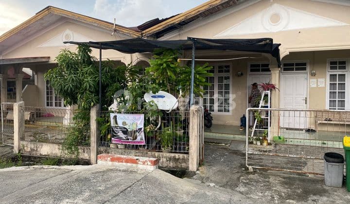 The house is located in a housing complex in the middle of the city.