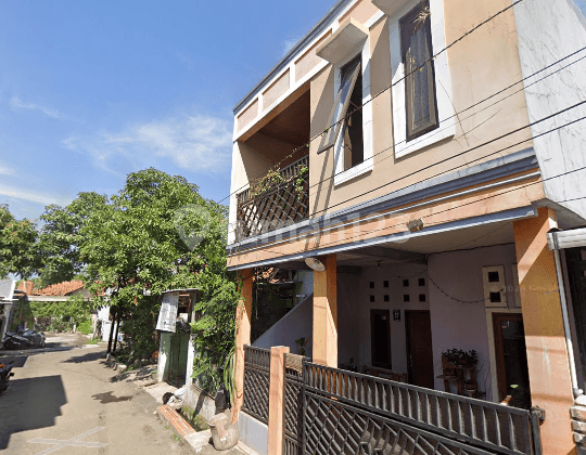 Two-story house in block A, east-facing view, Taman Cileunyi Housing Estate.