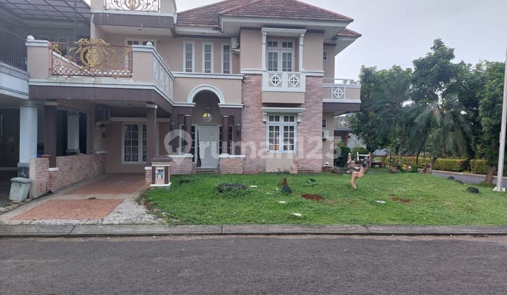 Two-story corner house inside Kota Wisata cluster.