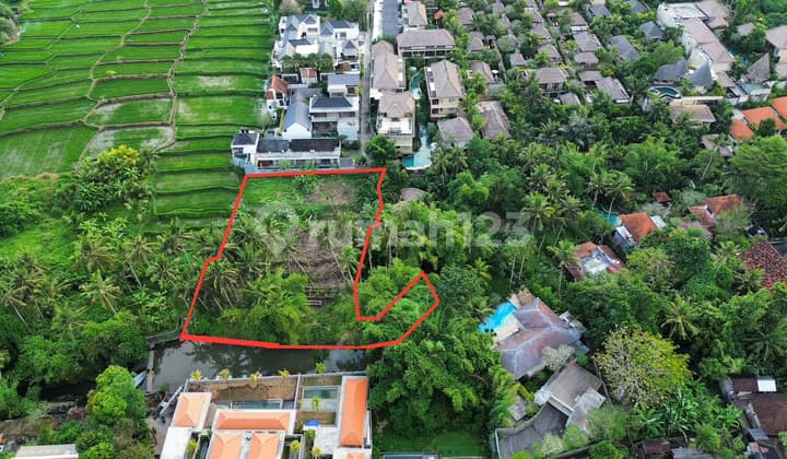 English: "Land for Sale with River and Rice Field Views, Premium Location in Ubud"