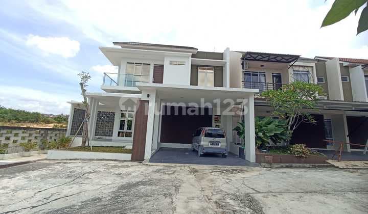 Minimalist 2-story house with full interior in Hangtuah, on Hangtuah Street.