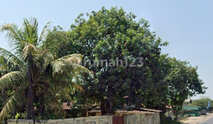 Bonus Land with House Building on Main Road Pusakajaya Street