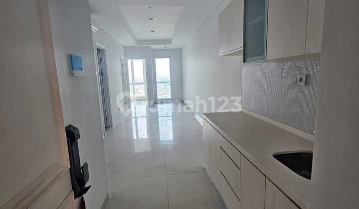 2BR Unfurnished Kondominium Grand Madison - Mall Central Park