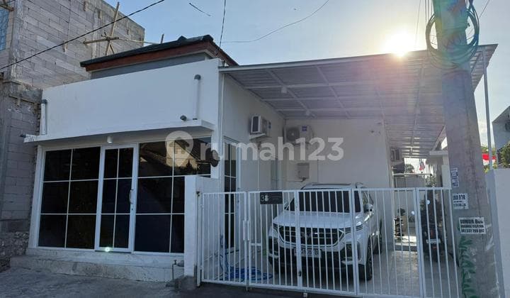 House on Corner with Garden Ambiance, Main Road Quite Wide in Jimbaran