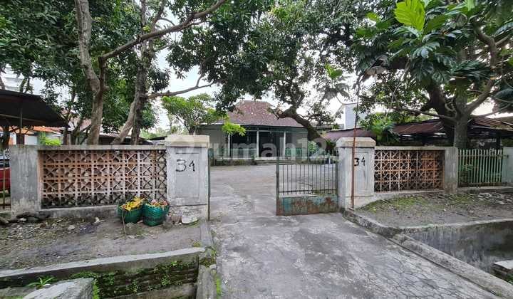 Strategic Land Near Jalan Gajah Mada Solo, Featuring a Joglo Building.