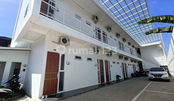 Two-story boarding house with 24 doors in the city center of Purwokerto.